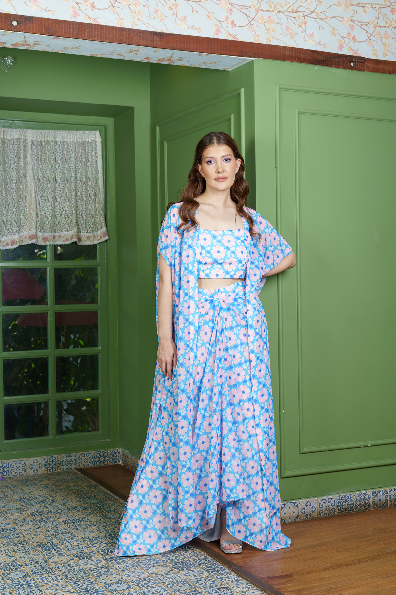 Model wearing floral dhoti set for women with crop top and long jacket – Indo western fusion outfit for festive and party wear